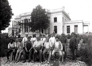 Work crew poses in front of the new mansion.